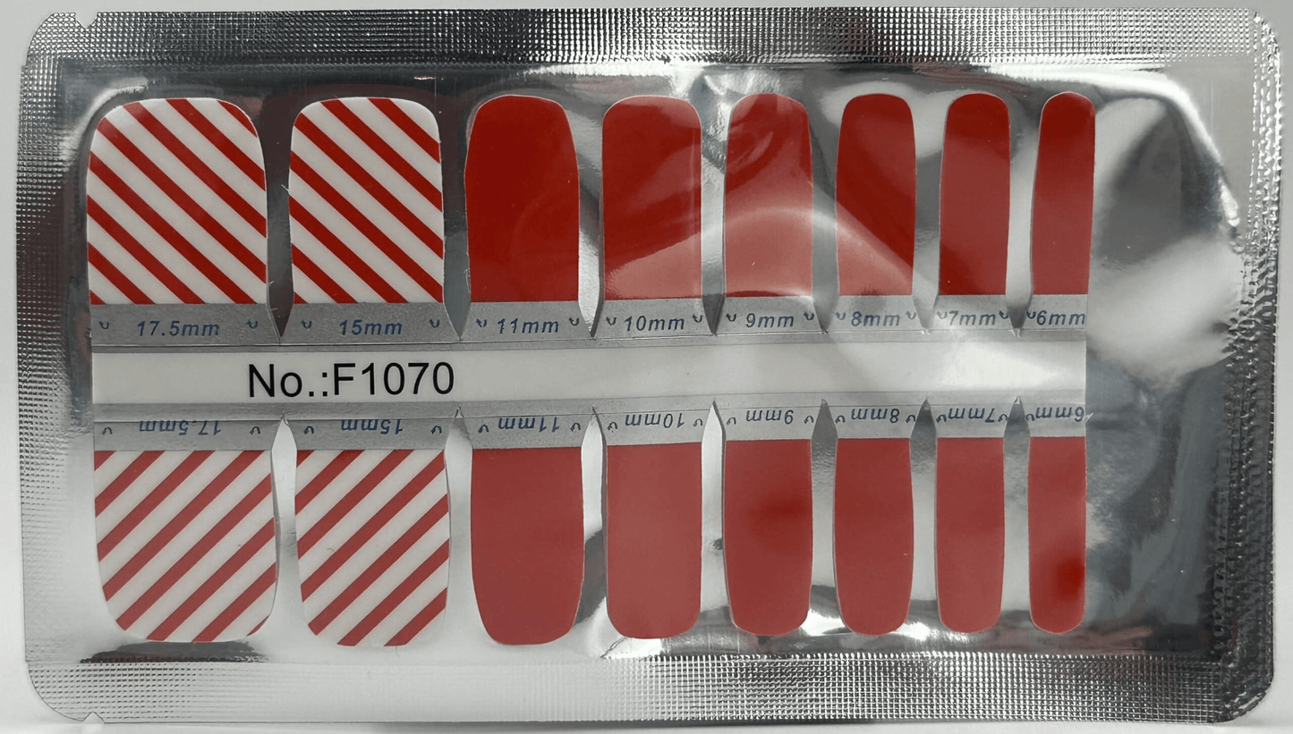 Red and white striped pedicure nail wraps sheet showing candy cane pattern designs