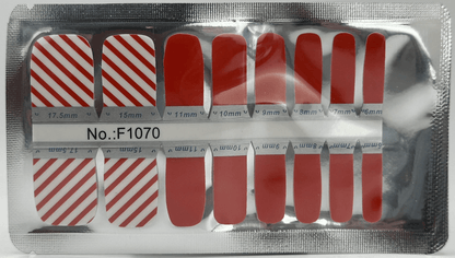 Red and white striped pedicure nail wraps sheet showing candy cane pattern designs