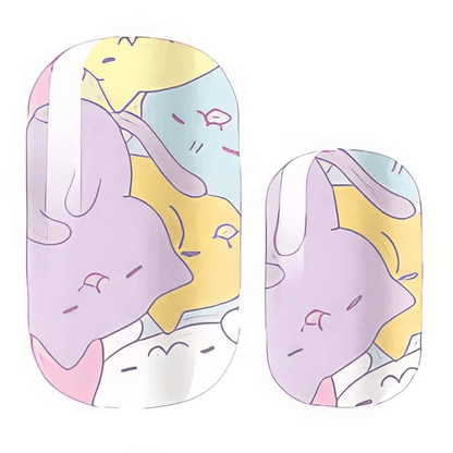 Pastel nail wraps featuring kawaii sleeping cats in purple yellow and blue tones