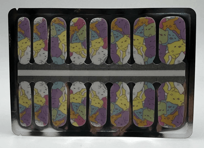 Non-UV nail wraps in packaging featuring cartoon cat design with purple yellow accents