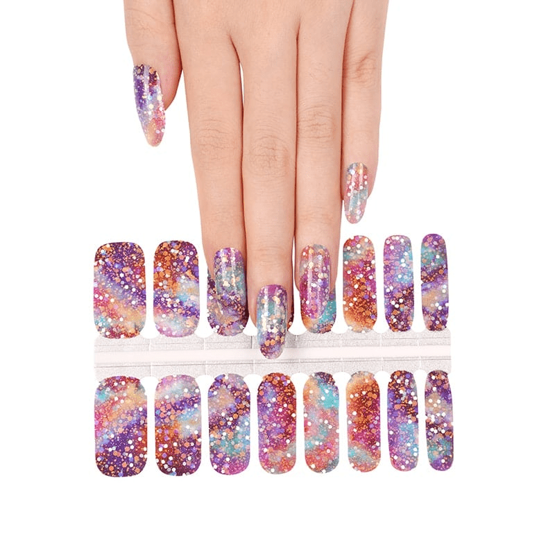 Galaxy glitter nail wrap sheet showing purple blue orange sparkle press-on nail designs