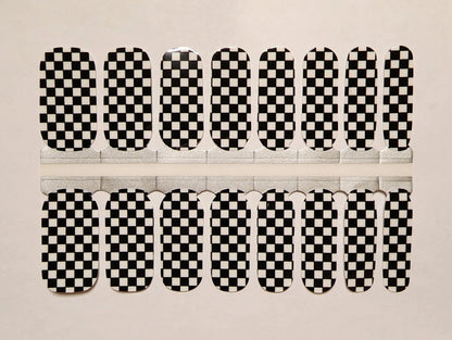 Black and white checkered nail wraps in classic checkerboard pattern for at-home manicure