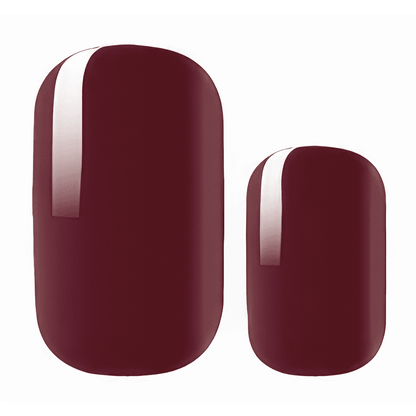 Two coffee brown nail wrap shapes showing glossy finish and rounded tips for gel manicure