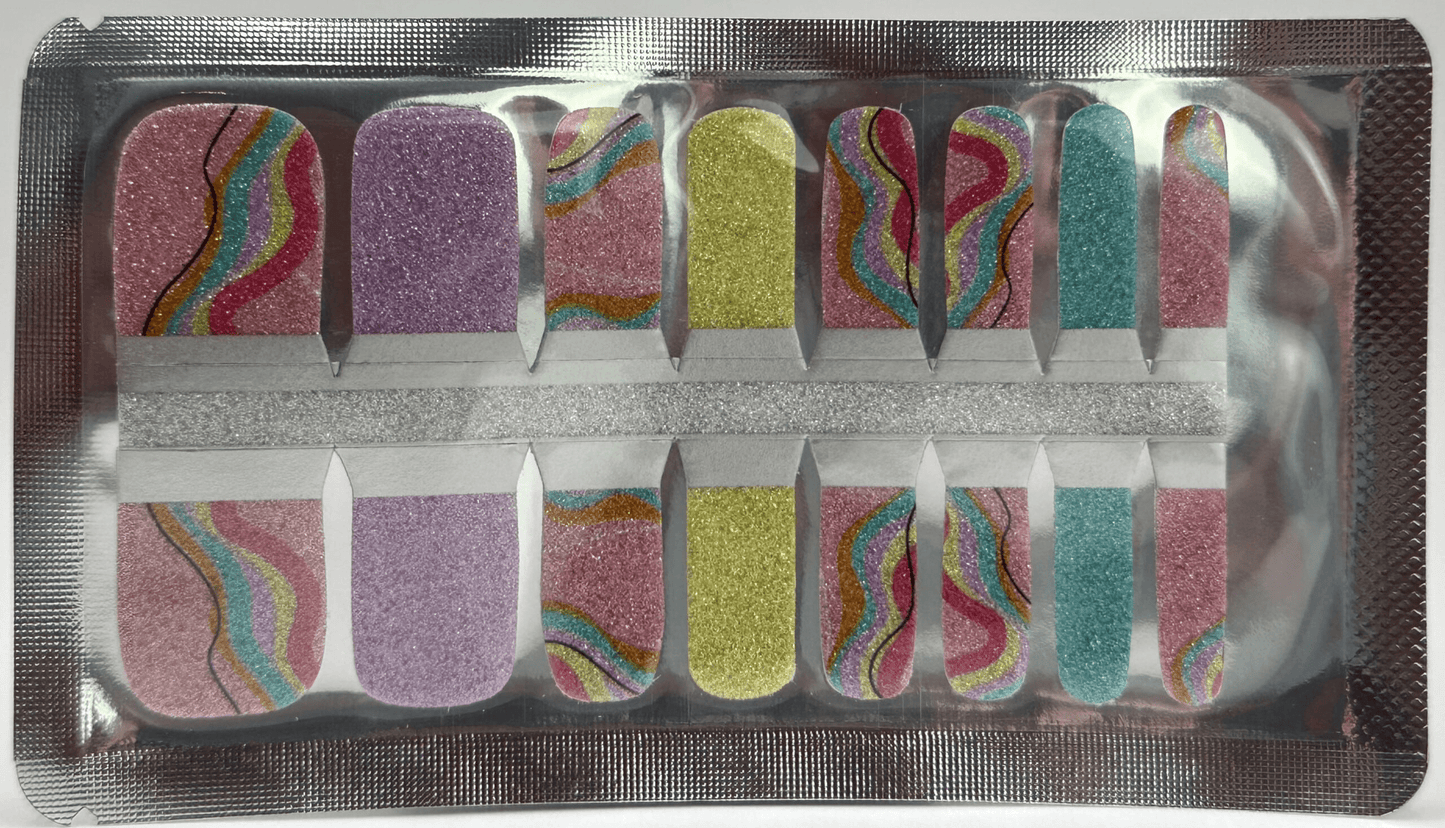 Glitter pedicure nail wraps in purple yellow blue with rainbow wave patterns for toe nail art