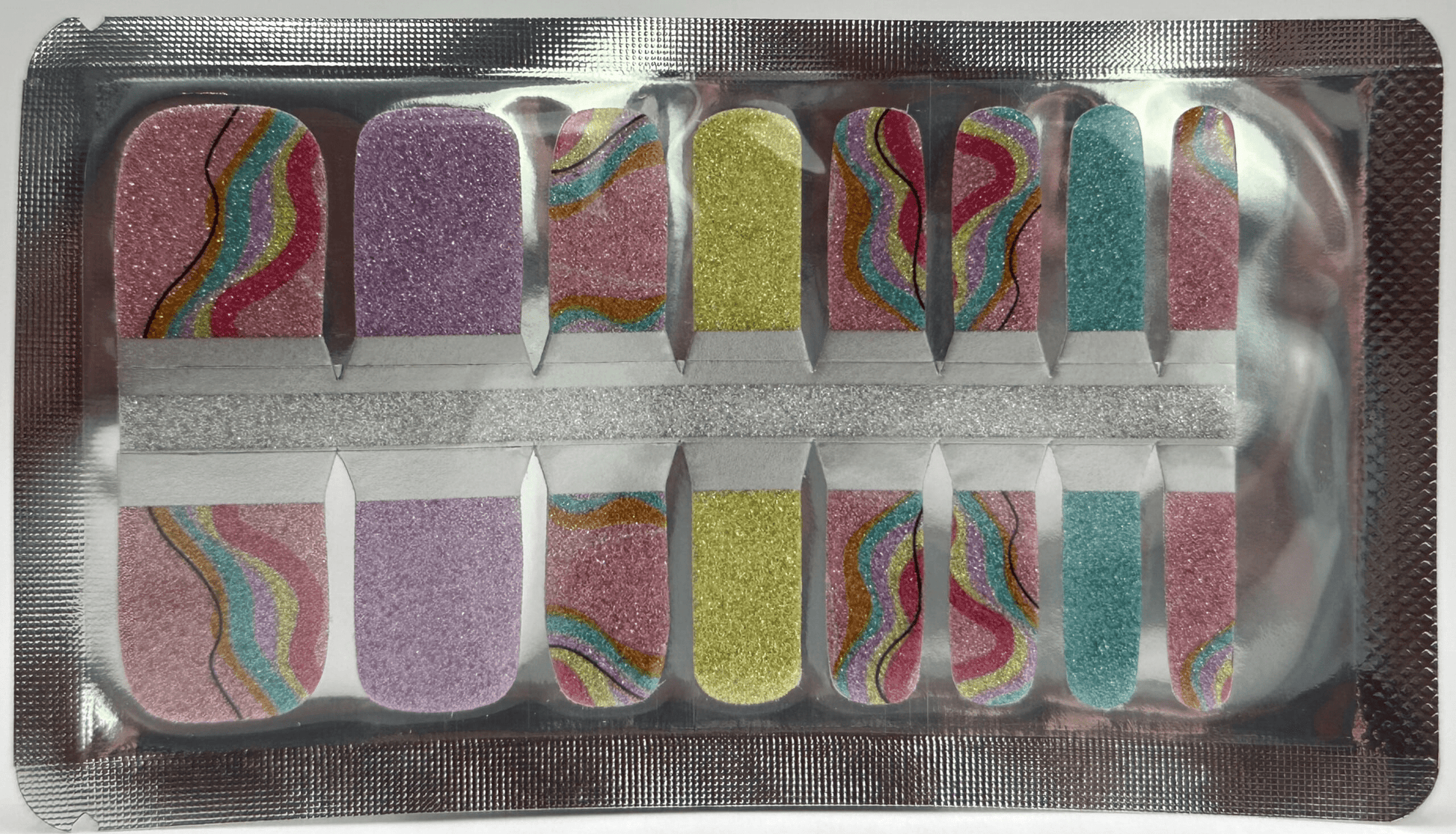 Glitter pedicure nail wraps in purple yellow blue with rainbow wave patterns for toe nail art