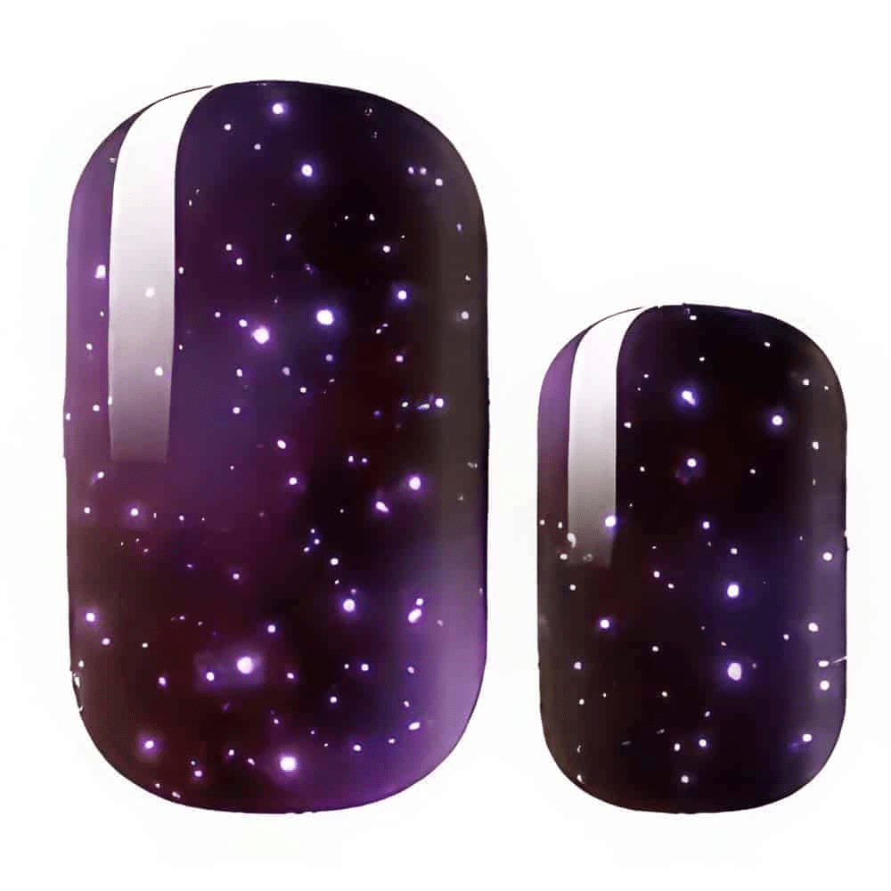 Purple galaxy nail wraps with glittery stars and cosmic sparkle effect