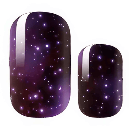 Purple galaxy nail wraps with glittery stars and cosmic sparkle effect