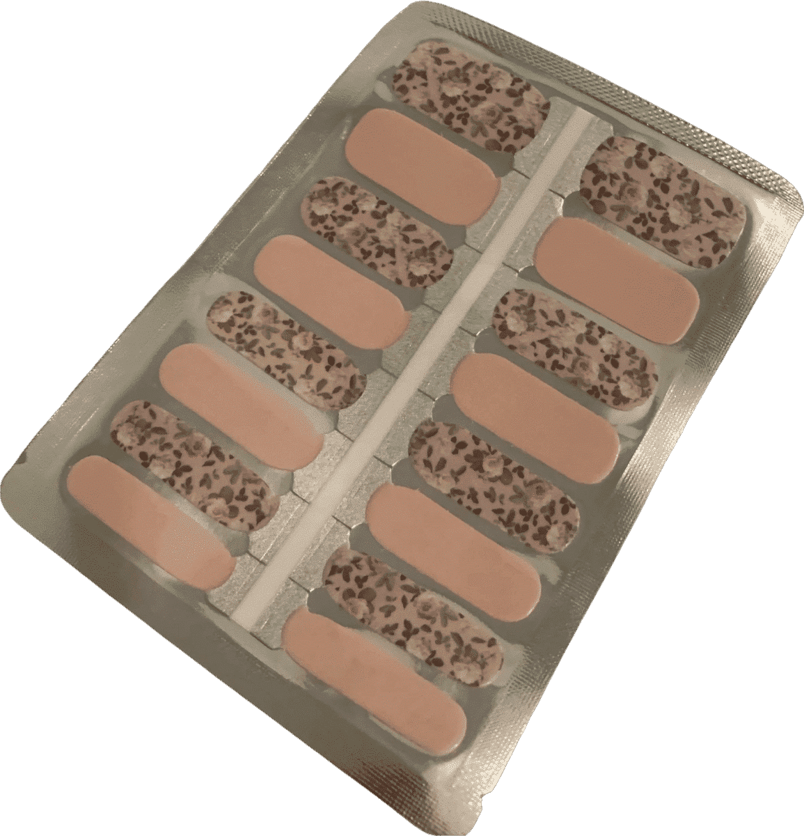 Nude and brown floral nail wraps with botanical leaf pattern for at-home manicure