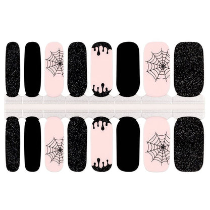 Gothic nail wrap sheet with black glitter, pink spider web and drip patterns