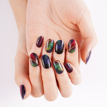 Dark iridescent nail wraps with rainbow chrome finish on manicured hands