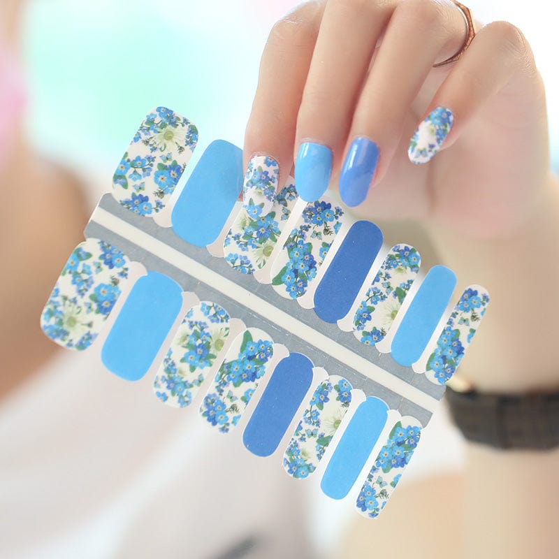 Non-UV nail wraps sheet featuring blue floral daisy pattern for at-home manicure