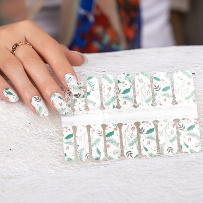White Christmas nail wraps with green holly leaves and red berries festive pattern design