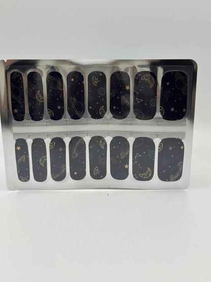 Deep space nail wraps sheet featuring dark blue cosmic pattern with planets and stars
