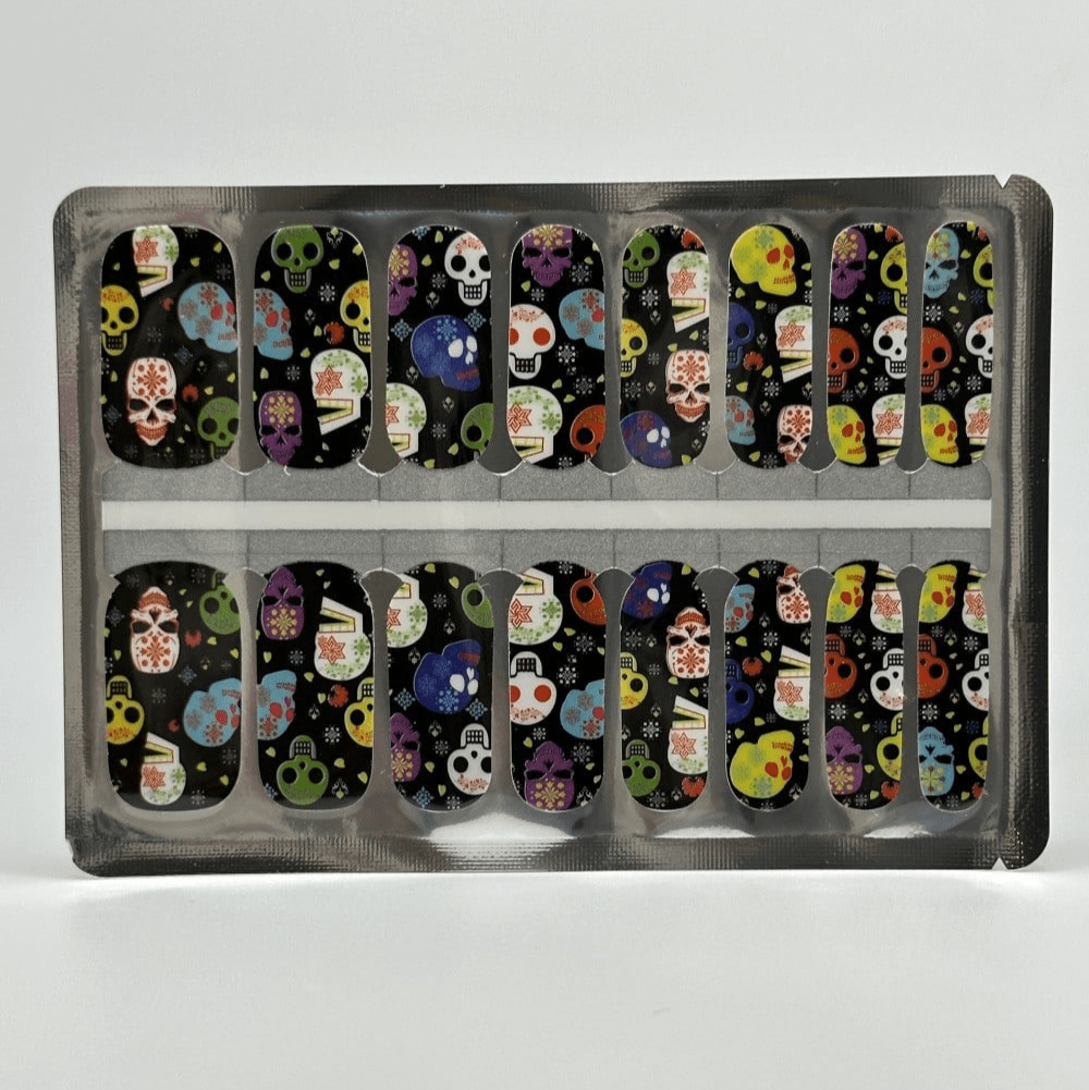 Colourful Day of the Dead skull pattern nail wraps in packaging for Halloween manicures