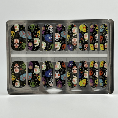Colourful Day of the Dead skull pattern nail wraps in packaging for Halloween manicures