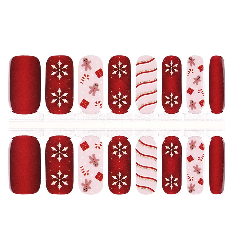 Festive Christmas nail wraps with red snowflakes, candy canes and holiday patterns for at-home manicure