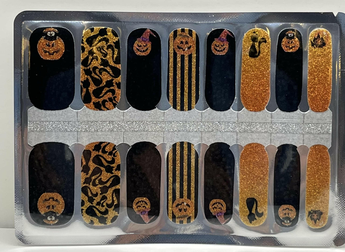 Halloween nail wraps sheet showing orange glitter pumpkins leopard print and striped patterns