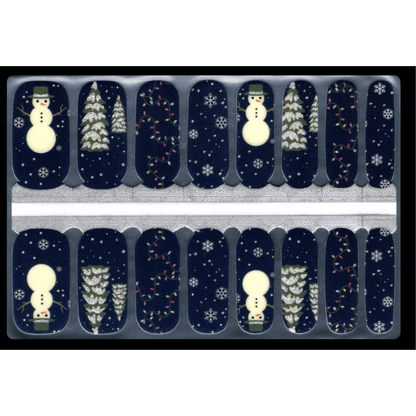 Navy blue nail wraps with white snowmen and Christmas trees festive winter design