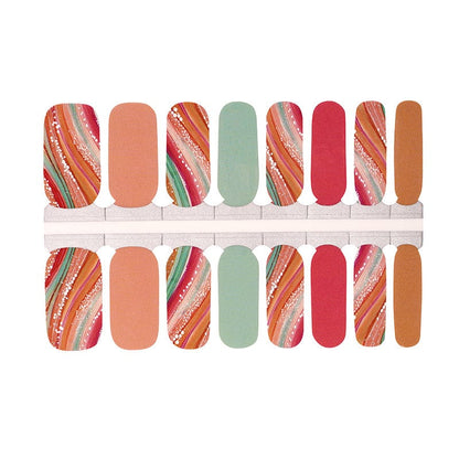 Non-UV nail wraps featuring coral, sage green, and metallic swirl patterns in autumn colour palette