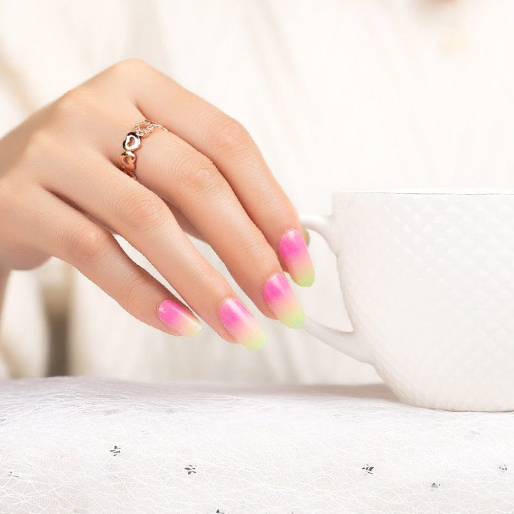Hand with pink yellow green gradient nail wraps hypercolour ombre manicure design