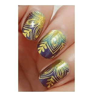Golden lotus nail wraps on hand showing ornate navy blue art nouveau design