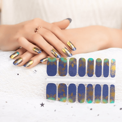 Non-UV nail wraps sheet in navy blue with golden lotus art nouveau design showing individual nail strips
