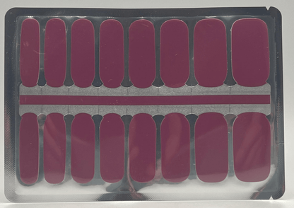 Sheet of burgundy non-UV nail wraps showing multiple sizes for at-home manicure