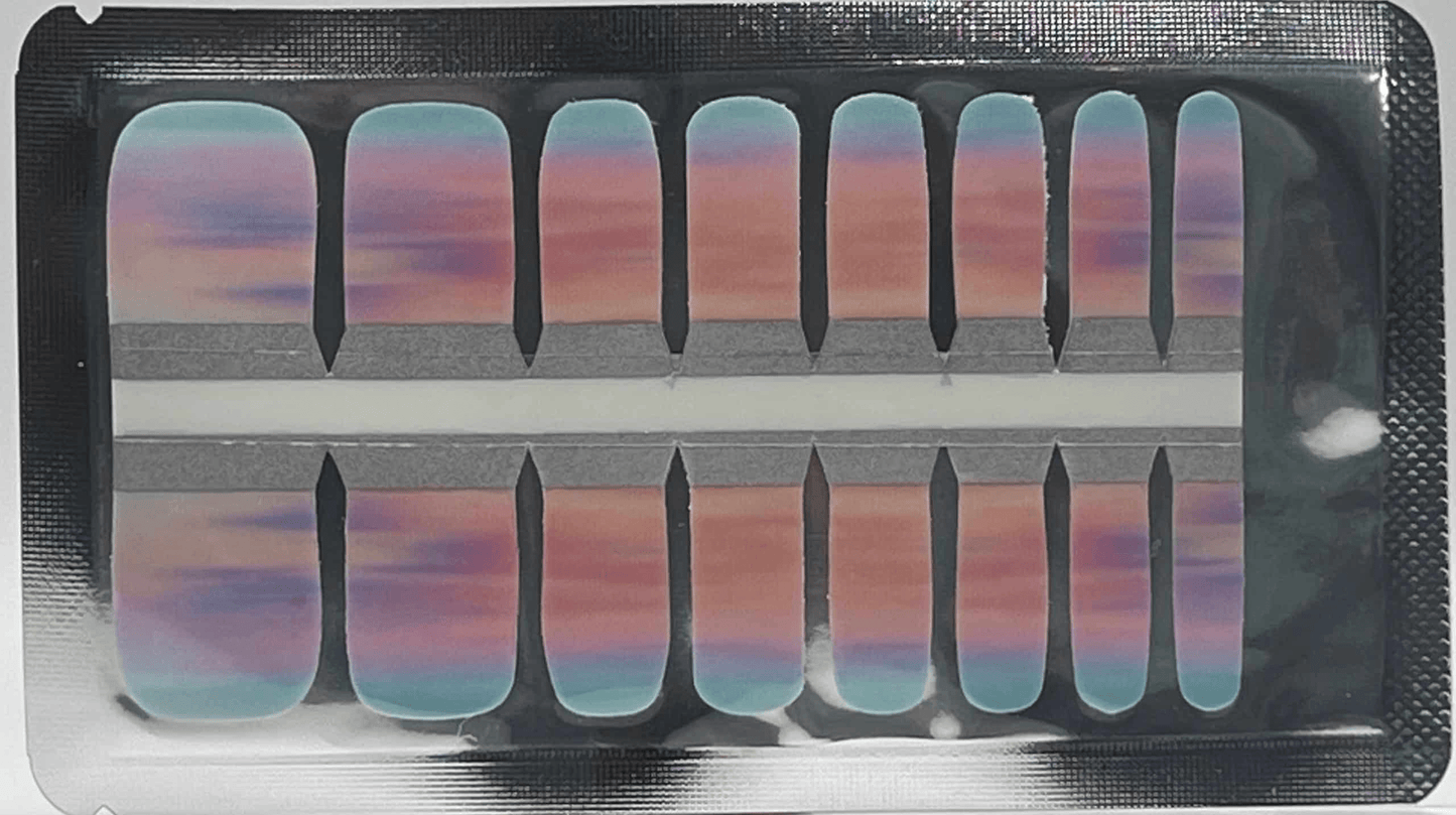 Sheet of pink to blue gradient pedicure nail wraps showing ombre sunset design
