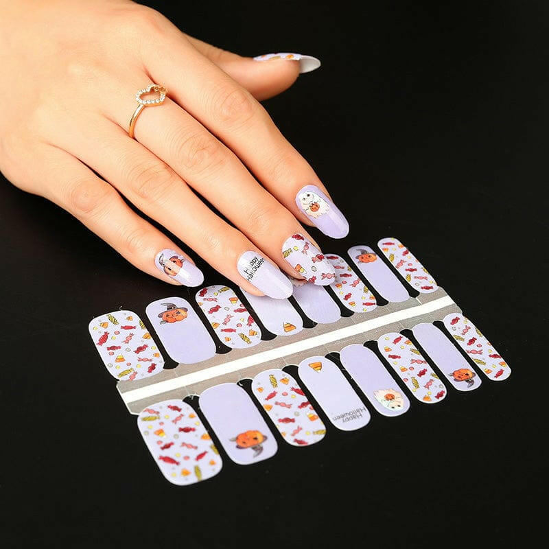 Purple and white Halloween nail wraps sheet with ghost and pumpkin cartoon designs