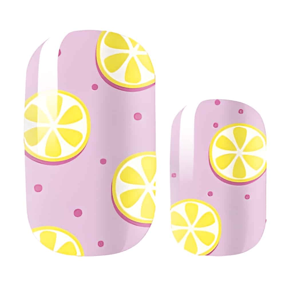 Pink nail wraps with yellow lemon slices and polka dot pattern for cute manicure
