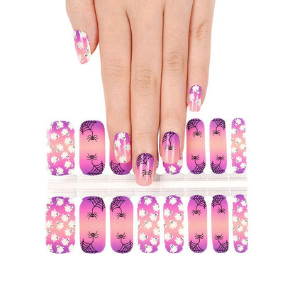 Halloween gel nail wraps featuring pink skulls and purple spider designs