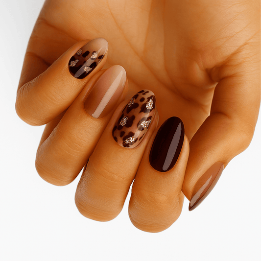 Brown leopard print gel nail wraps with glossy finish on hand manicure