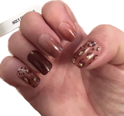 Brown leopard print nail art with glossy finish on natural nails manicure