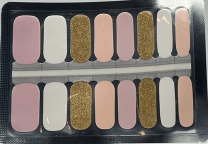 Non-UV nail wraps in nude pink tones with gold glitter accents for elegant manicure