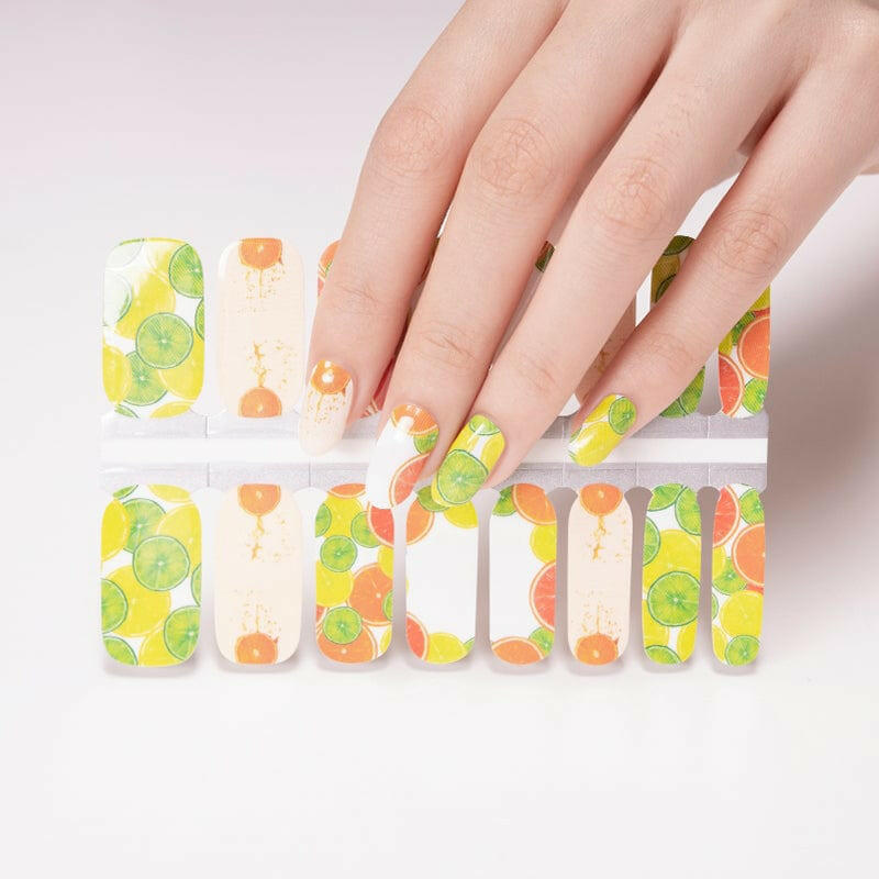 Citrus nail wrap sheet showing yellow, orange and green fruit pattern designs