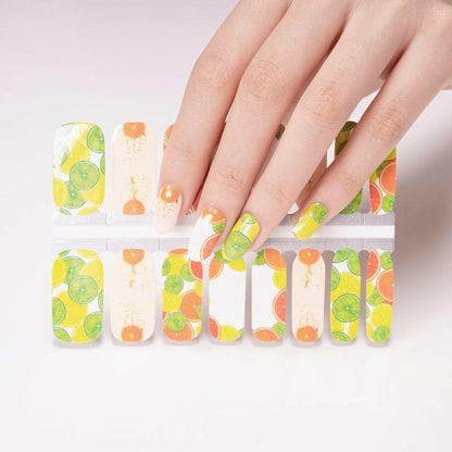 Citrus nail wrap sheet showing yellow, orange and green fruit pattern designs