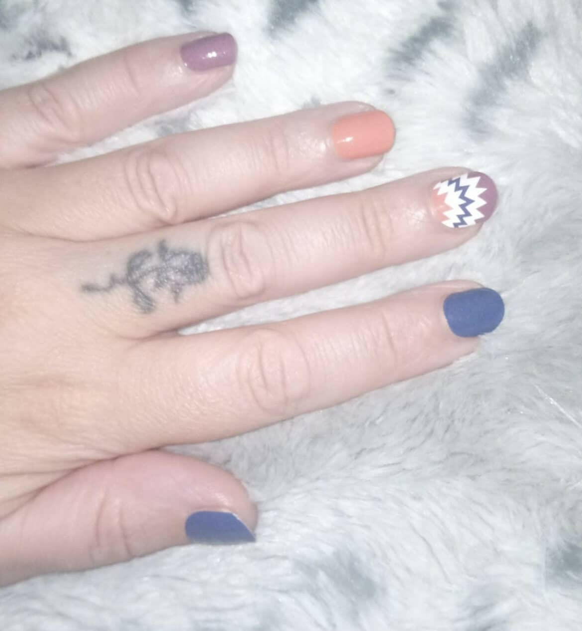 Autumn nail wraps in orange brown navy with geometric accent nail design