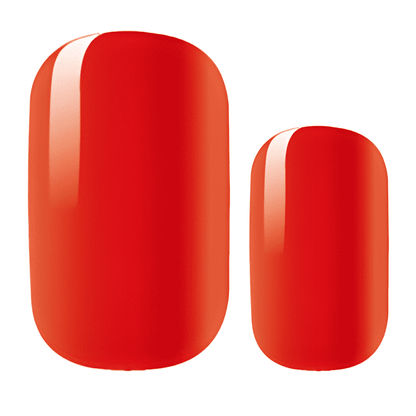 Two glossy red nail wraps showing size comparison for press-on nails