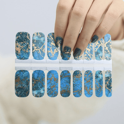 Blue and gold marble nail wraps sheet showing stone pattern design for manicure