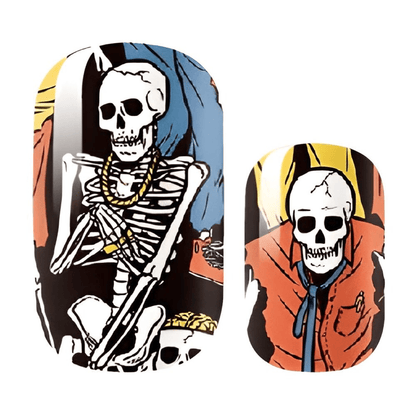 Close-up of skeleton nail wraps showing detailed gothic Halloween nail art in vibrant colours