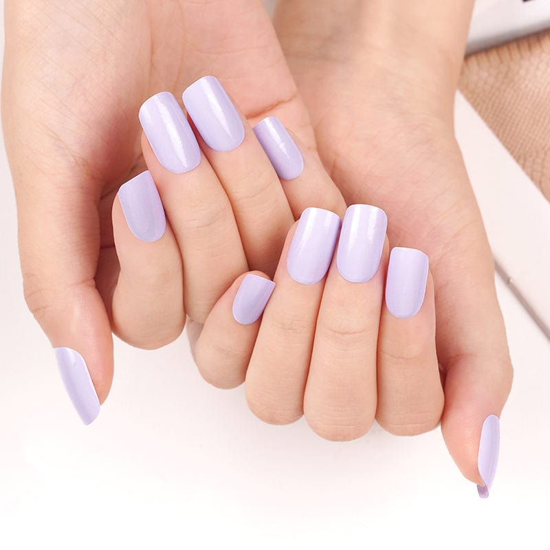Purple lavender nail wraps on both hands displaying elegant pastel at-home manicure