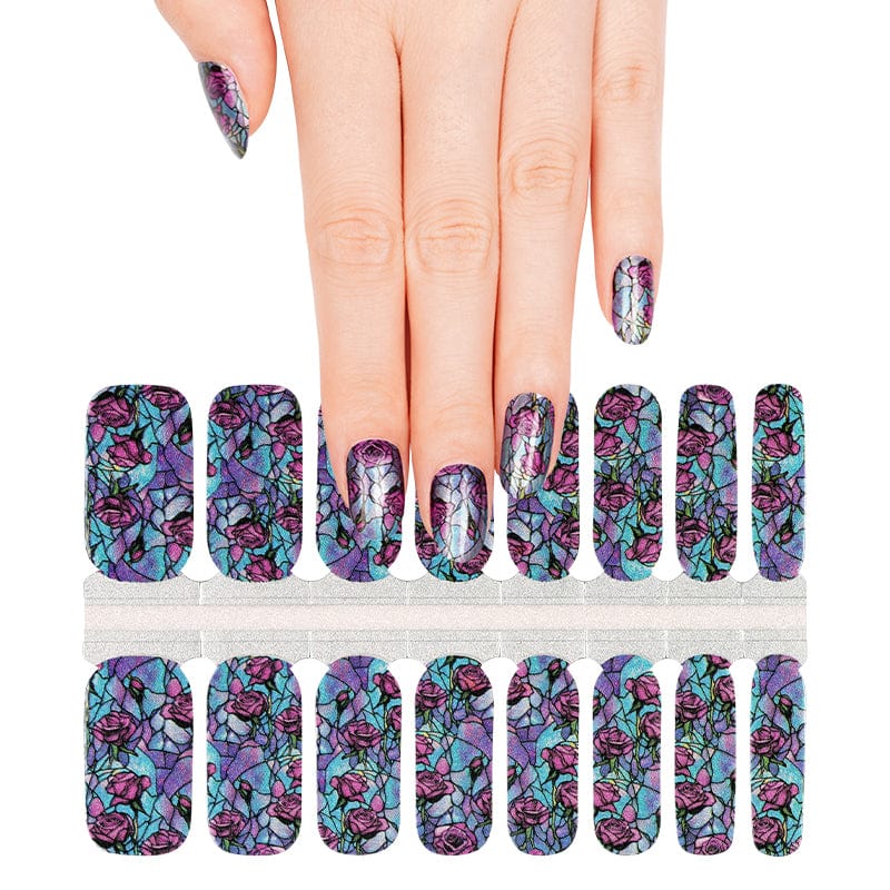 Hand displaying non-UV nail wraps sheet with purple pink stained glass rose pattern strips