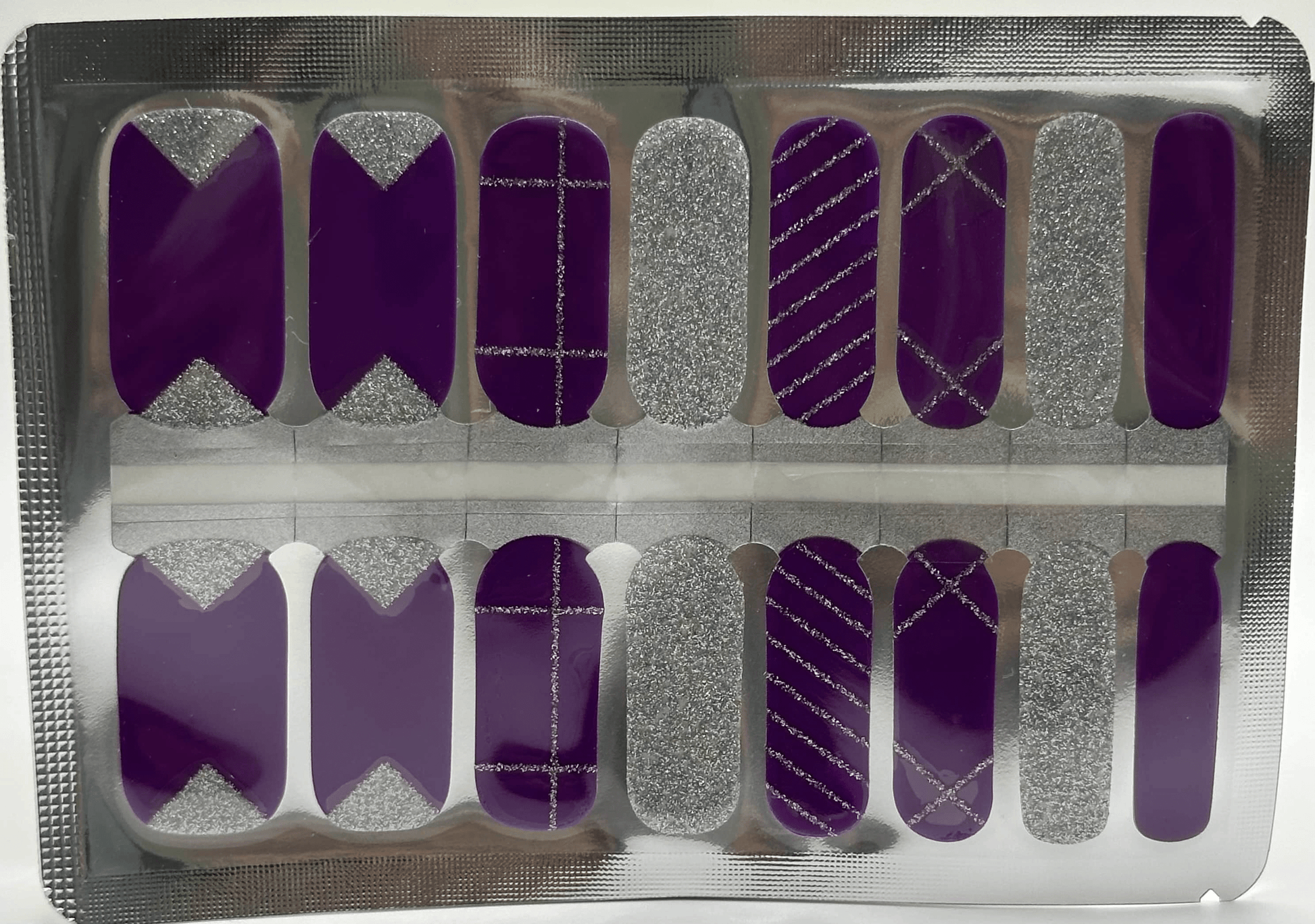 Disco inspired purple and silver metallic nail wraps with geometric glitter patterns