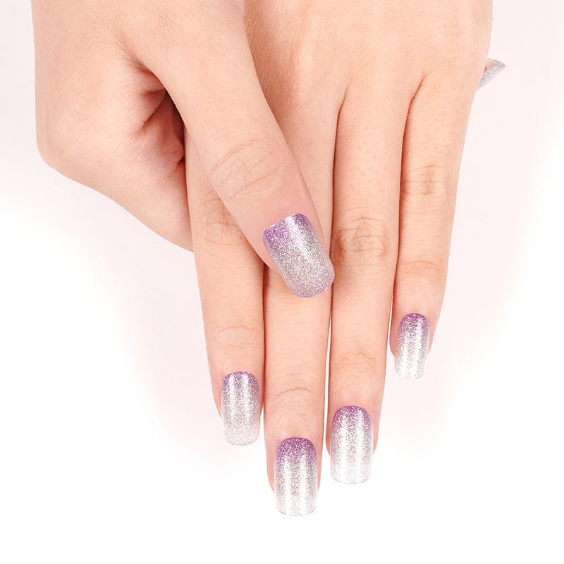 Purple to silver gradient glitter nail wraps applied on both hands gel nails