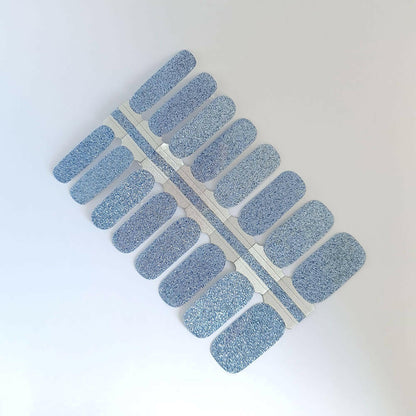 Dusty blue glittery non-UV nail wraps sheet showing textured shimmer finish for at-home manicures