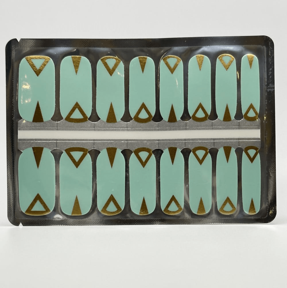 Teal non-UV nail wraps with gold art deco triangular design in packaging