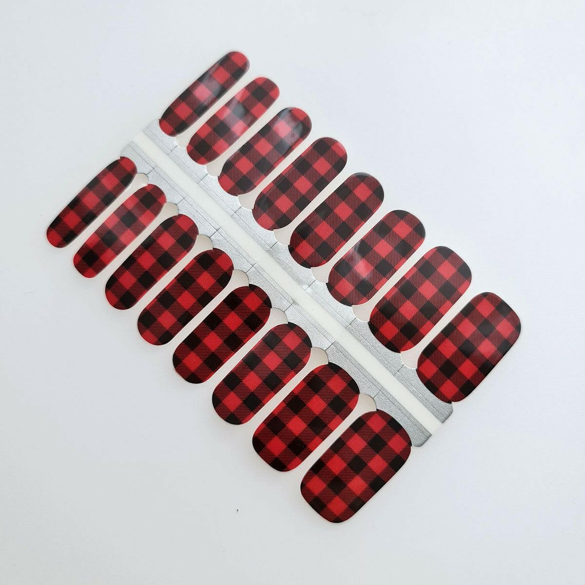 Red and black buffalo check plaid nail wraps in classic lumberjack pattern