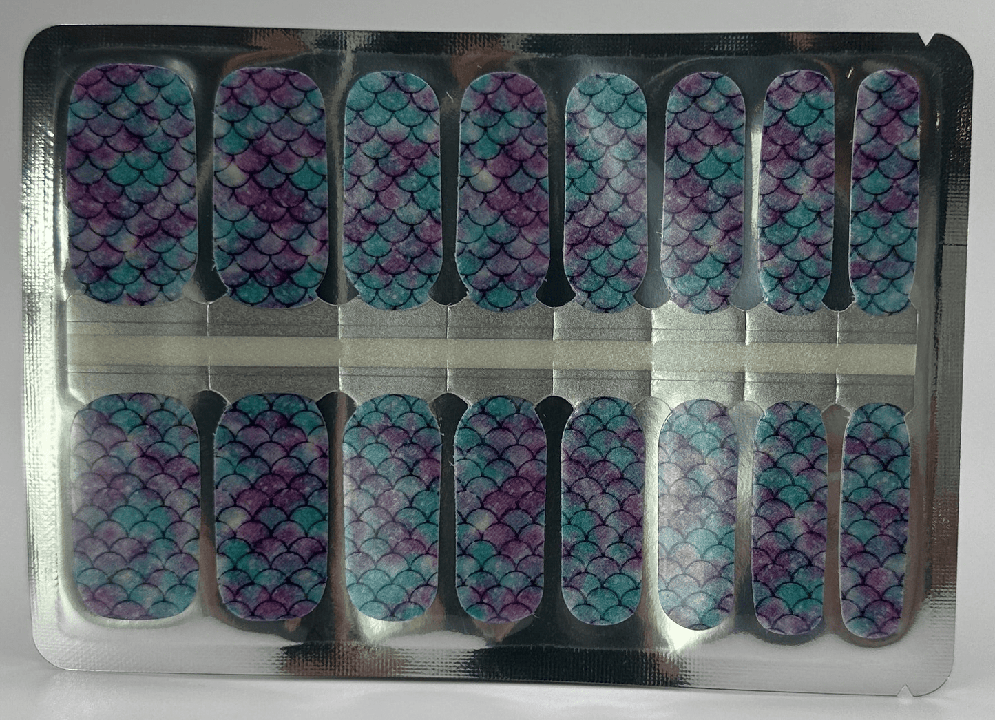 Sheet of iridescent mermaid scale nail wraps in blue purple holographic pattern