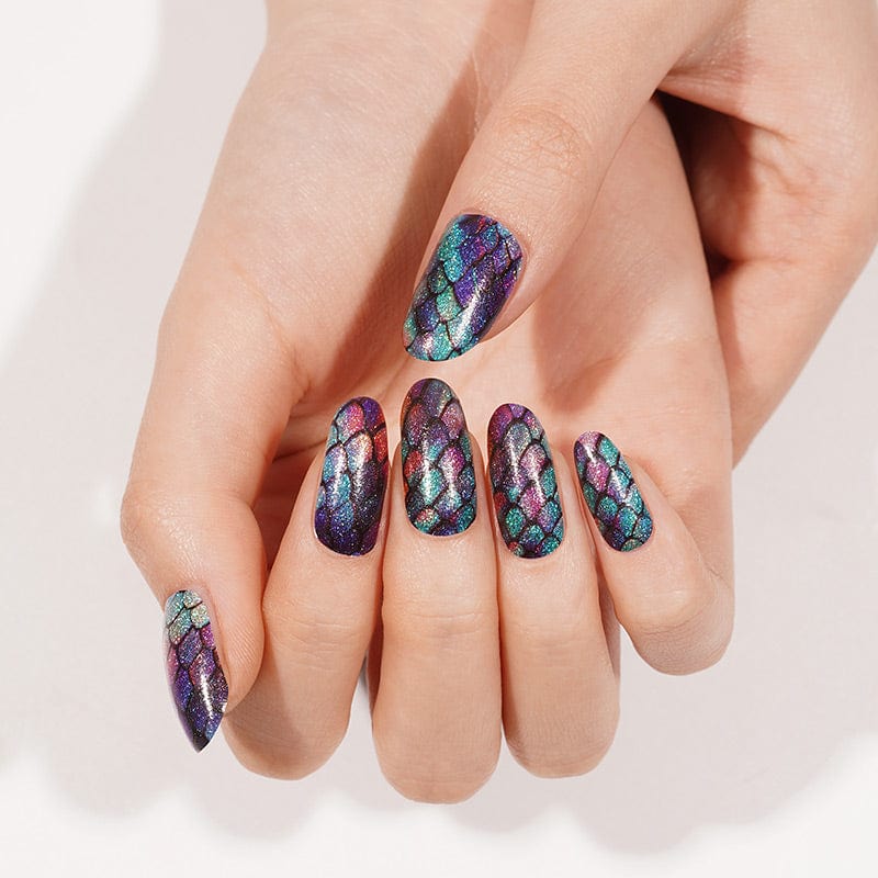 Holographic mermaid scale nail art on hands showing iridescent shimmer effect