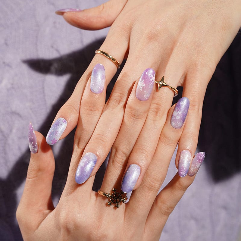Lilac and purple ombré nail wraps with shimmer and white snowflake designs